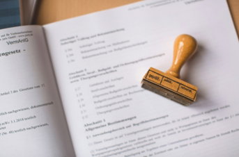 brown-wooden-hand-tool-on-white-printer-paper.jpg brown wooden hand tool on white printer paper