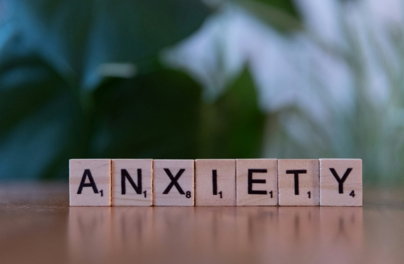 a-wooden-block-spelling-the-word-anxiety-on-a-table.jpg A wooden block spelling the word anxiety on a table