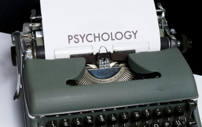 a close up of a typewriter with a paper on it