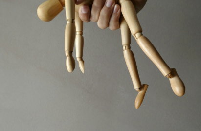 person-holding-brown-wooden-mannequin.jpg person holding brown wooden mannequin